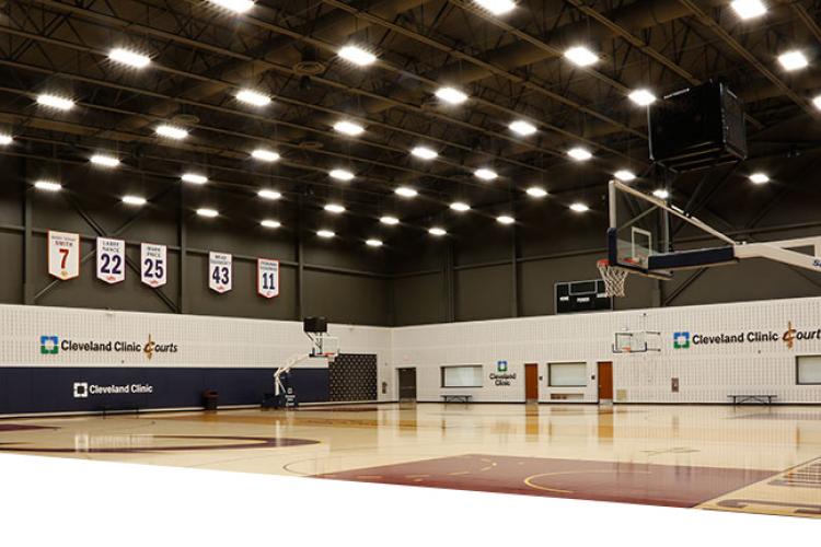 Indoor basketball court lit up