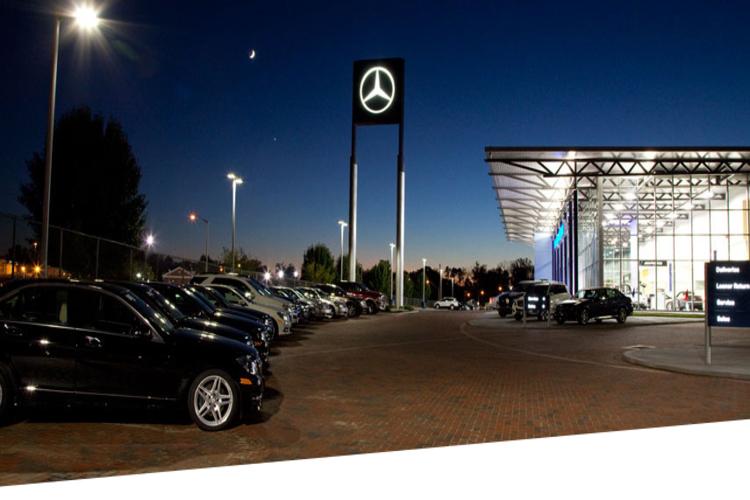 Mercedes-Benz signage and outdoor showroom at night. 