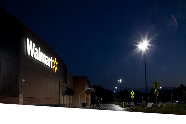 Walmart signage and parking lot at night 