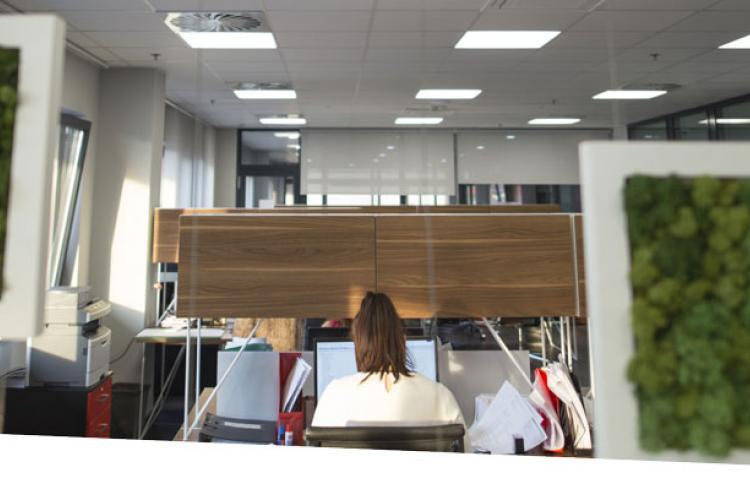 Interior, lady sitting in commercial office space